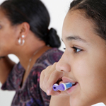 Brushing teeth together 150×150